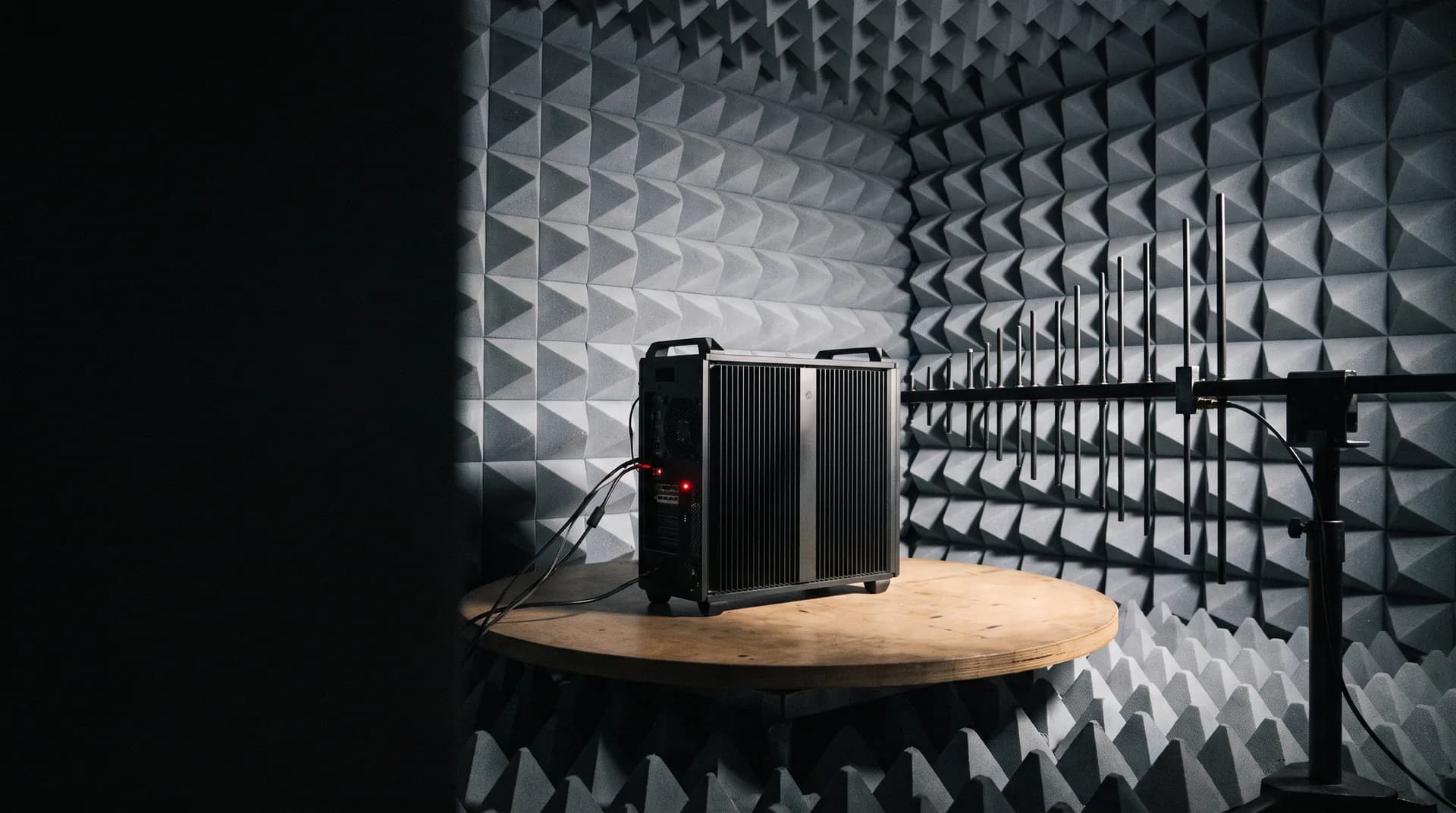 EMC anechoic chamber: pyramidal absorber walls and a unit on the turntable